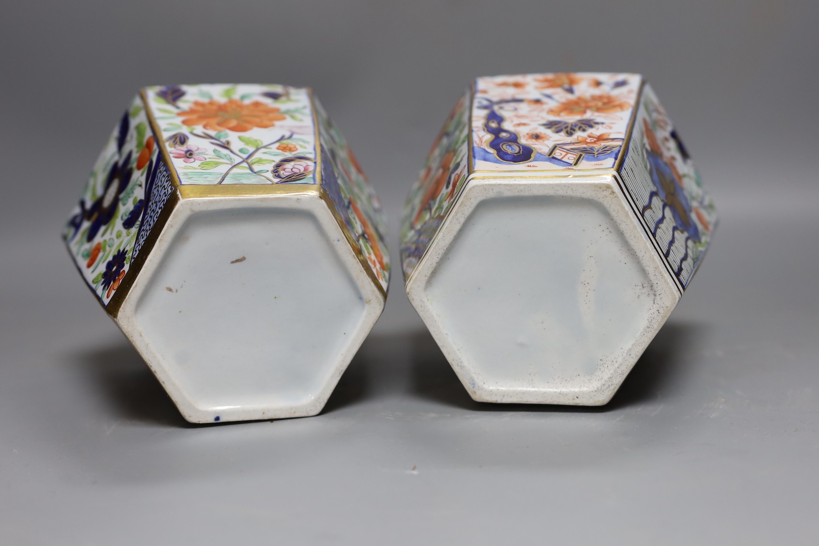 A pair of early 19th century Masons hexagonal ironstone jars and covers 24cm, impressed mark ‘Patent Ironstone China’ to covers only